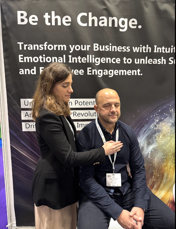 aude-firming-performing-reiki-at-the-london-business-show-2024